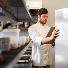 chef looking into the refrigerator